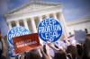 Win McNamee - TNS
Pro-choice and anti-abortion activists demonstrate in front of the Supreme Court building in Washington this week.