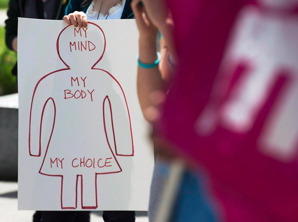 Andrew Vaughan - THE CANADIAN PRESS
A protester holds a pro-choice sign in Halifax, during a demonstration for access to abortion services in this file photo.