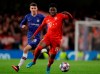 Bayern's Alphonso Davies, right, is challenged by Chelsea's Mason Mount during a first leg, round of 16, Champions League soccer match between Chelsea and Bayern Munich at Stamford Bridge stadium in London, England, Tuesday Feb. 25, 2020. (AP Photo/Kirsty Wigglesworth)