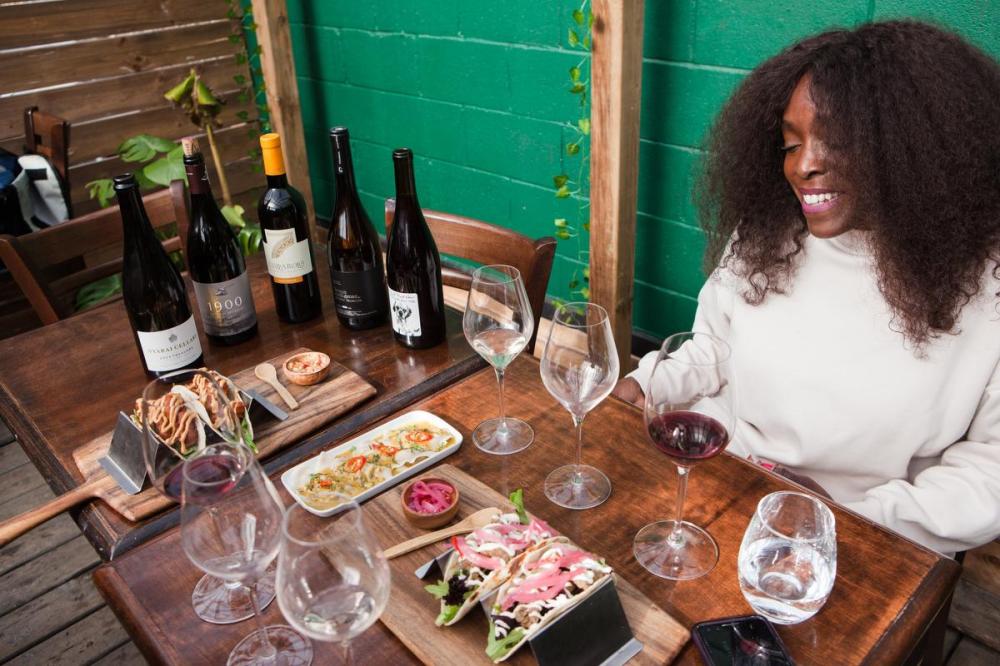 Angelyn Francis - Angelyn Francis/Toronto Star
Bottles of wine, including a sparkling wine from Niagara and a Pinotage from South African, are brought by sommelier Beverly Crandon to serve alongside lobster tacos, curry crab dumplings and fried chicken tacos at Caribbean restaurant Chandon Beni