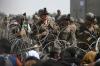 AFP Contributor#AFP - AFP via GETTY IMAGES
U.S. soldiers stand guard behind barbed wire as Afghans sit on a roadside near the military part of the airport in Kabul on August 20, 2021, hoping to flee from the country after the Taliban's military takeover of Afghanistan.