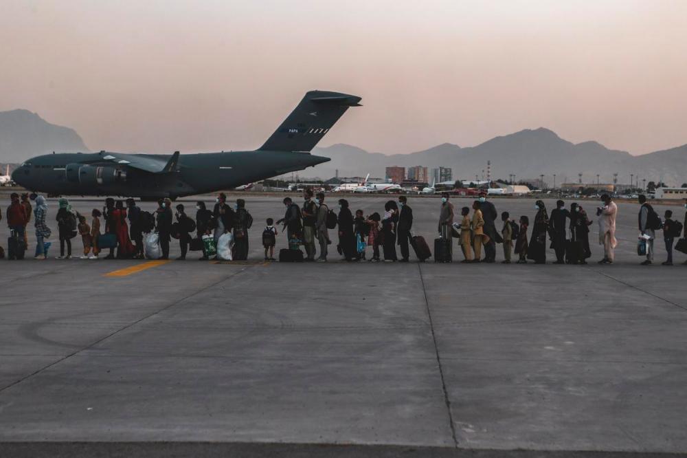 Sgt. Isaiah Campbell - AP
In this image provided by the U.S. Marine Corps, evacuees wait to board a Boeing C-17 Globemaster III, at Hamid Karzai International Airport, Kabul, Afghanistan, on Monday.