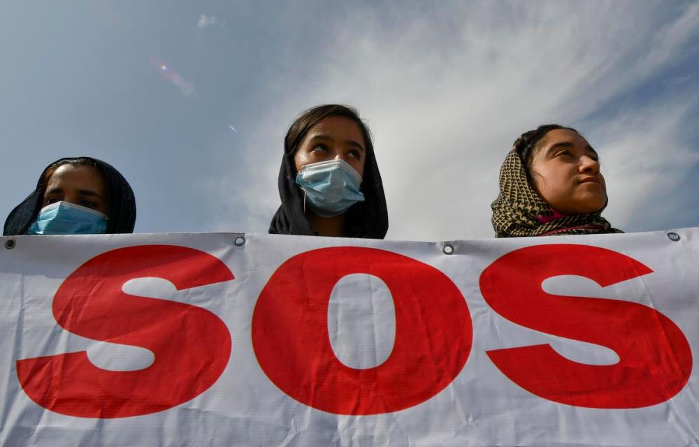 Vladimir Voronin - AP
Afghan women rally outside the U.S. embassy in Bishkek, Kyrgyzstan on Aug. 19. The stories of those we abandoned in Afghanistan will haunt the election campaign, Robin V. Sears writes.