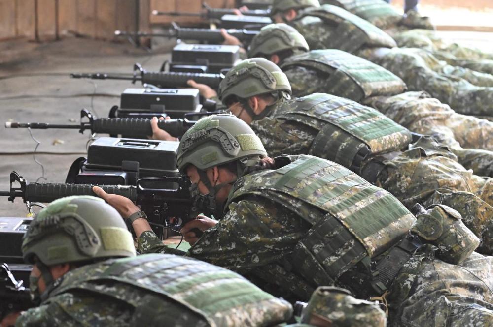 SAM YEH - AFP via Getty Images
Taiwan reservists take part in a military training at a military base in Taoyuan on March 12, 2022.