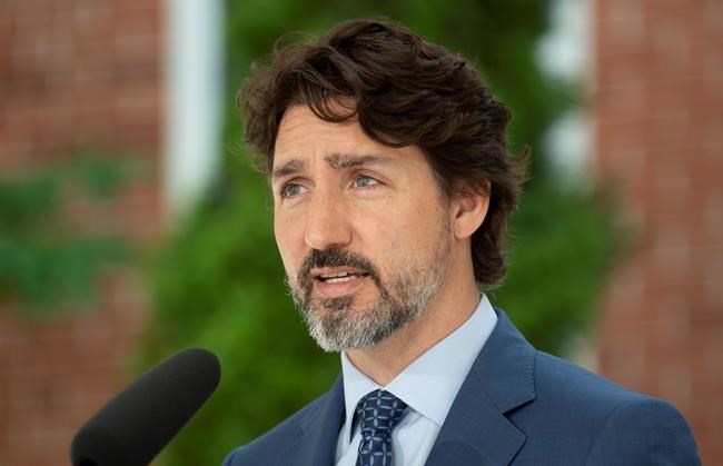 Prime Minister Justin Trudeau delivers his opening remarks during a news conference outside Rideau Cottage in Ottawa, Monday June 22, 2020. THE CANADIAN PRESS/Adrian Wyld