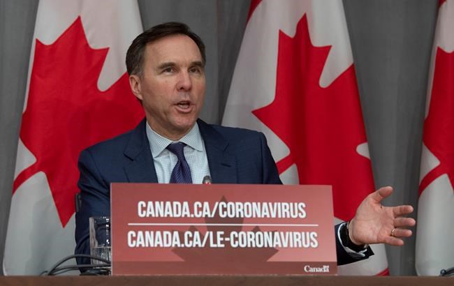 Minister of Finance Bill Morneau responds to a question during a news conference in Ottawa, Friday, March 27, 2020. THE CANADIAN PRESS/Adrian Wyld