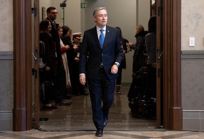 Foreign Affairs Minister Francois-Philippe Champagne makes his way to update reporters on the the evacuation of Canadians from China following caucus in Ottawa, Wednesday, February 5, 2020. THE CANADIAN PRESS/Adrian Wyld