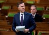 Minister of Finance Bill Morneau introduces a government bill during a special sitting of Parliament in the House of Commons Wednesday March 25, 2020 in Ottawa. THE CANADIAN PRESS/Adrian Wyld