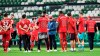 Bayern's head coach Hansi Flick, center, talks to his players after winning the German Bundesliga soccer match between Werder Bremen and Bayern Munich in Bremen, Germany, Tuesday, June 16, 2020. Bayern became champion for the 30th time in Germany. Because of the coronavirus outbreak all soccer matches of the German Bundesliga take place without spectators. (AP Photo/Martin Meissner, Pool)