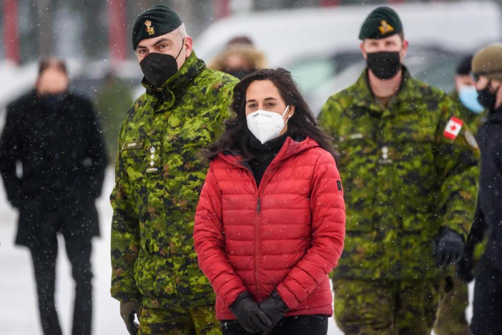 GINTS IVUSKANS - AFP via GETTY IMAGES
Canada's Minister of Defence Anita Anand arrives to meet with Canadian NATO troops in Adazi, Latvia, on February 3, 2022.