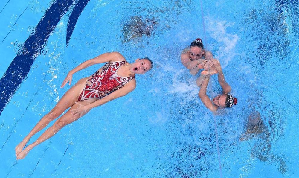 OLI SCARFF - AFP via GETTY IMAGES
Canada performs its free routine in the artistic swimming team event during the Tokyo 2020 Olympic Games. The Canadians finished sixth overall.