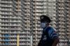 Carl Court - GETTY IMAGES
A police officer stands guard next to an accommodation building in the Tokyo Olympics athletes village on July 19, 2021 in Tokyo, Japan.