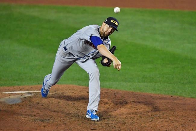 New York Mets starting pitcher Jacob deGrom throws to a Toronto Blue Jays batter during the sixth inning of a baseball game in Buffalo, N.Y., Friday, Sept. 11, 2020. (AP Photo/Adrian Kraus)