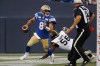 CP
Winnipeg Blue Bombers quarterback Zach Collaros (8) outruns Hamilton Tiger-Cats defensive end Ja'Gared Davis (56) during first half of the August 5 game. (John Woods / Canadian Press files)