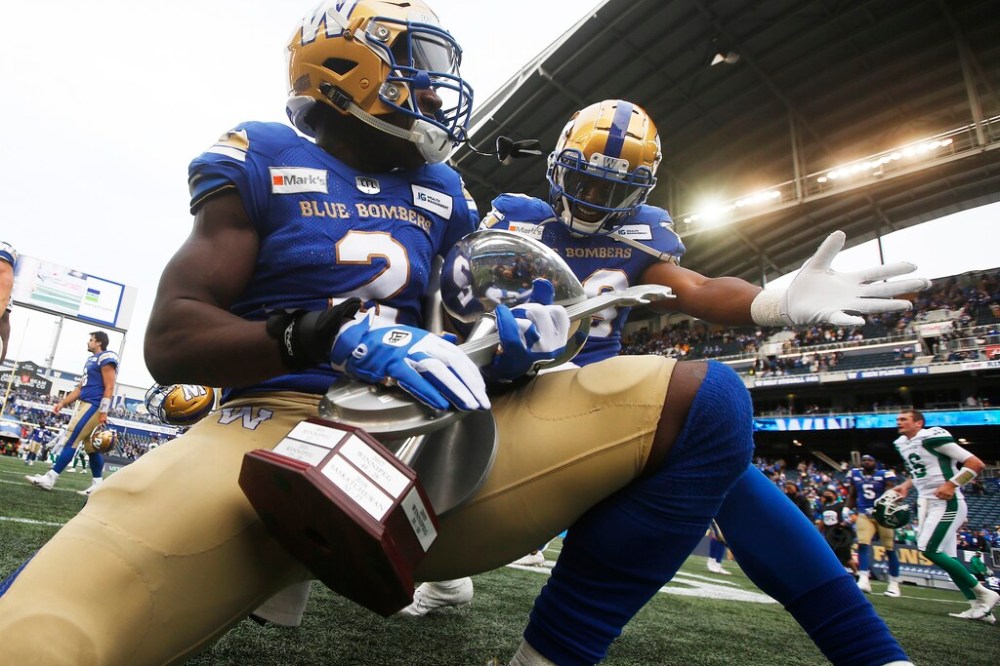 CP
Jonathan Kongbo (left) and Jontrell Rocquemore celebrate the Bombers Banjo Bowl victory on Saturday. (John Woods / The Canadian Press files)