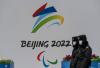 Kevin Frayer - GETTY IMAGES
Security walk by a billboard for the Beijing 2022 Winter Olympics and Paralympics. The Olympics, which start Feb. 4, seem certain to be the authoritarian Games, Bruce Arthur writes.