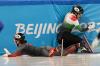 David J. Phillip - AP
Florence Brunelle, left, of Canada, and Petra Jaszapati of Hungary crash in the mixed team relay final during the short-track speedskating competition at the 2022 Winter Olympics, Saturday, Feb. 5, 2022, in Beijing.