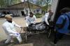 GENYA SAVILOV - AFP via GETTY IMAGES
Mortuary workers unload the body of a victim in Bucha on Thursday, amid the Russian invasion of Ukraine.