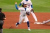 Toronto Blue Jays shortstop Bo Bichette throws to first for the out after fielding a ball hit by Tampa Bay Rays' Yandy Diaz during the third inning of a baseball game Saturday, Aug. 15, 2020, in Buffalo, N.Y. (AP Photo/Jeffrey T. Barnes)