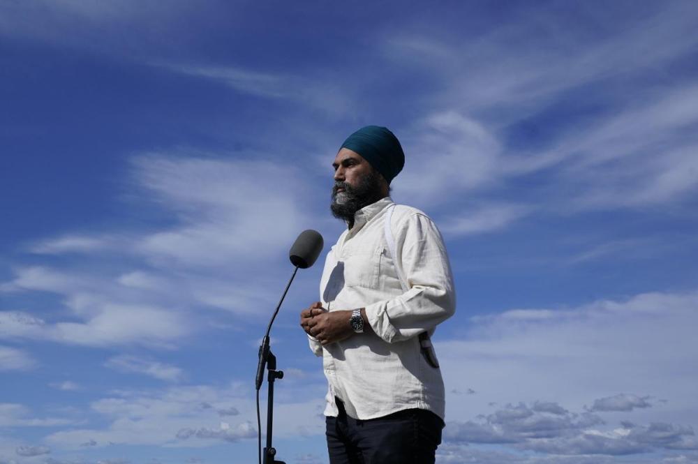 Adrian Wyld - The Canadian Press
NDP Leader Jagmeet Singh speaks with the media before boarding his campaign plane in Quebec City on Sept. 3, 2021.