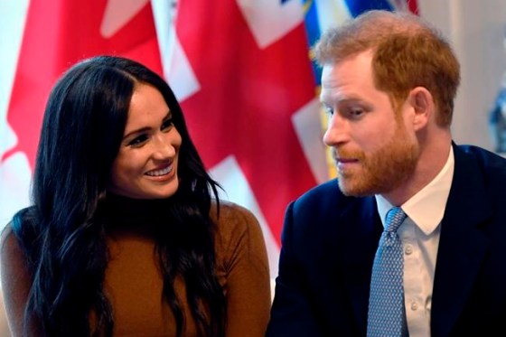 Britain's Prince Harry and Meghan, Duchess of Sussex smile during their visit to Canada House in thanks for the warm Canadian hospitality and support they received during their recent stay in Canada, in London, Tuesday, Jan. 7, 2020. (Daniel Leal-Olivas/Pool Photo via AP)