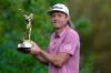 Lynne Sladky - AP
Cameron Smith, of Australia, holds the trophy after winning The Players Championship golf tournament Monday