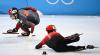 ANNE-CHRISTINE POUJOULAT - GETTY IMAGES
Canada’s Pascal Dion skates past fallen Chinese skater Li Wenlong in the short-track relay semifinals. Later, a review determined there was no illegal contact in the race, but both teams will advance to the final.