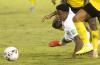 Collin Reid - The Associated Press
Canadian Jonathan David gets hauled down by a pair of Jamaican defenders in a physical World Cup qualifier in Kingston.
