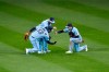 Toronto Blue Jays left fielder Lourdes Gurriel Jr., left, center fielder Randal Grichuk, top, and right fielder Cavan Biggio celebrate their win over the New York Yankees in a baseball game in Buffalo, N.Y., Monday, Sept. 7, 2020. (AP Photo/Adrian Kraus)