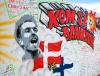 JONATHAN NACKSTRAND - AFP via GETTY IMAGES
A picture shows a mural with the name and portrait of Denmark's midfielder Christian Eriksen on a wall at the Football Village at Ofelia Beach in Copenhagen, Denmark on June 15, 2021, three days after the Danish star collapsed during the Euro 2021 match between Denmark and Finland.