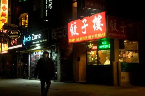 A restaurant worker is seen in the window of an eatery in Toronto on Saturday, May 9, 2020. THE CANADIAN PRESS/Chris Young