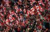 JASON FRANSON - THE CANADIAN PRESS
Canadian fans wave the flag for the men’s national soccer team during a World Cup qualifying match in Edmonton on Friday. More than 48,000 filled Commonwealth Stadium on a chilly night.