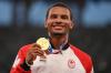 INA FASSBENDER - AFP via GETTY IMAGES
Gold medallist Canada's Andre De Grasse poses on the podium Thursday, a day after winning the men's 200-metre event at the Tokyo 2020 Olympic Games.