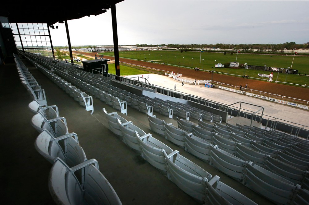 JOHN WOODS / WINNIPEG FREE PRESS
Race 2 finishes in front of empty stands at Assiniboia Downs Monday. The Downs opened its race season tonight with an empty grandstand and the races broadcast on television and online.