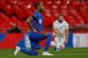 ADRIAN DENNIS -  GETTY IMAGES file photo
England midfielder Raheem Sterling takes a knee in a pre-game show of unity against racism before a World Cup qualifier against San Marino in March. Sterling and his teammates kick off their delayed Euro 2020 campaign against Croatia on Sunday.