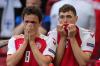 FRIEDEMANN VOGEL - AFP via GETTY IMAGES
Denmark midfielder Thomas Delaney and defender Andreas Christensen react as paramedics attend to teammate Christian Eriksen after he collapsed on the pitch on June 12, 2021.