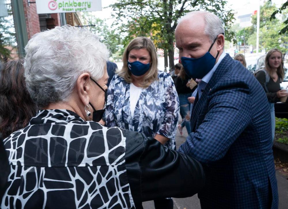 Adrian Wyld - THE CANADIAN PRESS
Federal Conservative Leader Erin O'Toole and his wife Rebecca meet supporters before stopping at a coffee shop on Sept. 16, 2021 in Saint John, N.B.