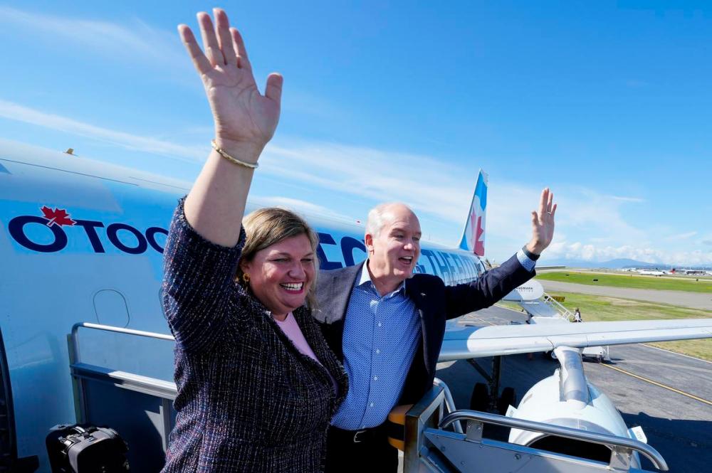 Frank Gunn - THE CANADIAN PRESS
Federal Conservative Leader Erin O'Toole and his wife Rebecca wave before entering the party's campaign plane in Vancouver, B.C. on Sept. 12, 2021.
