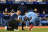 Rene Johnston - Toronto Star
Toronto Blue Jays Santiago Espinal in pain after being hit by a pitch is being attended to by trainer in an earlier game last week.
