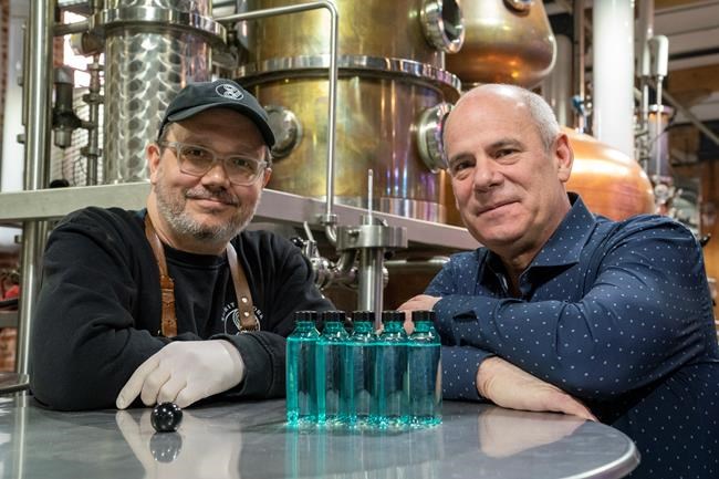 Spirit of York Head Distiller Mark Harrop (left) and founder Gerry Guitor pose with bottles of distillery-made hand sanitizer in Toronto on Wednesday March 18, 2020. With an outbreak of the novel coronavirus sweeping across Canada, Toronto-based Spirit of York Distillery Co. had an urge to do something to help, so they looked no further than the company's production facility. Instead of pumping out its usual vodkas and gins, the company decided to make something Canadians have been emptying from store shelves: hand sanitizer. THE CANADIAN PRESS/Frank Gunn