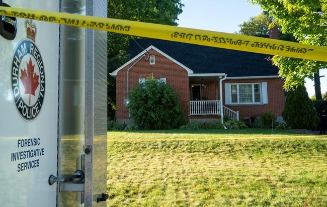 A Durham Police forensics truck sits in front of a home on Parklane Avenue in Oshawa, Ont. on Friday, September 4, 2020. Durham Regional Police say five people were found dead and another with serious injuries in the home east of Toronto after an early morning shooting. THE CANADIAN PRESS/Frank Gunn