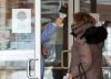 Frank Gunn - THE CANADIAN PRESS
A woman has her temperature taken as she arrives at a long term care home in Barrie.