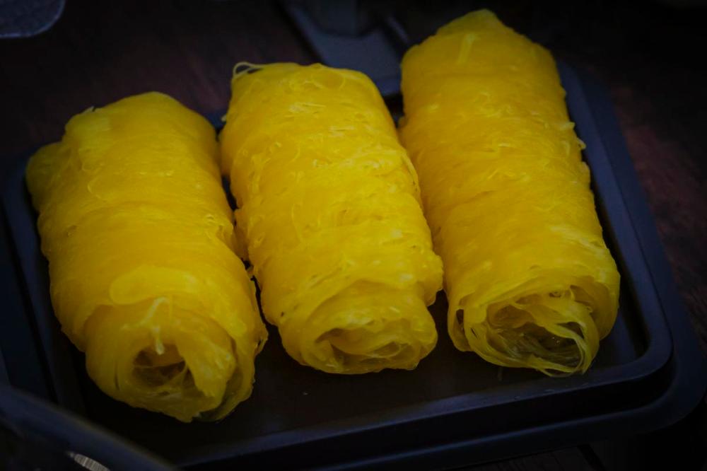Giovanni Capriotti - For Toronto Star
Foi tong, thin strands of egg yolks cooked in syrup, are wound into bundles.