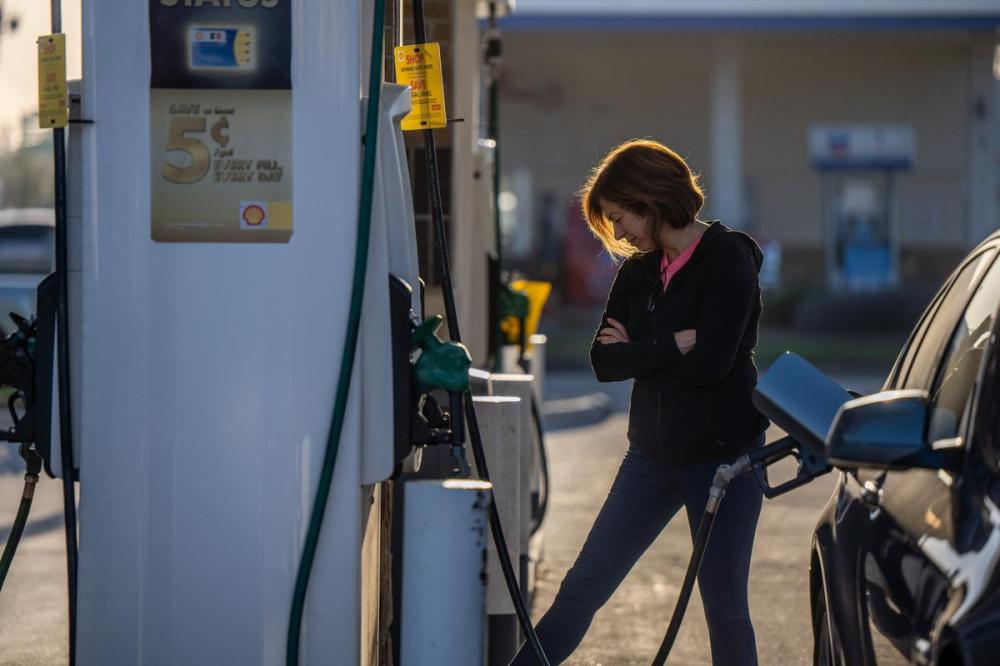 Brandon Bell - Getty Images
A person prepares to pump gas at a Shell gas station in Houston, Texas. Rising gas prices around the world have been attributed to Russia's invasion of Ukraine.