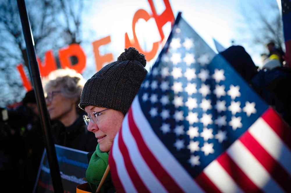 Wendy Hudgins, 49, was part of a group of activists gathered outside the U.S. Capitol on Wednesday to show lawmakers the American people want the House to vote to impeach. (Sarah L. Voisin / The Washington Post)