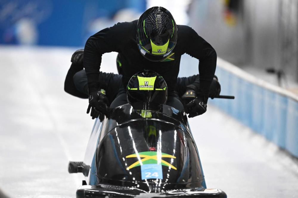 DANIEL MIHAILESCU - AFP via GETTY IMAGES
Jamaica's Shanwayne Stephens and his team take part in the 4-man bobsleigh training at the Yanqing National Sliding Centre during the Beijing 2022 Winter Olympic Games on Tuesday.