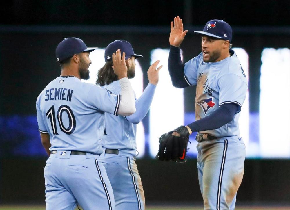 Richard Lautens - Toronto Star
The Jays celebrate their win over the New York Yankees 6-5 at The Rogers Centre.