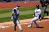 John Minchillo - The Associated Press
Blue Jays third baseman Cavan Biggio charged a slow roller but D.J. LeMahieu reached first safely, allowing Gio Urshela, right, to score in the second inning on Saturday.