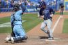 Mike Carlson - AP
The Rays’ Brett Phillips trots home past catcher Danny Jansen on a bases-loaded walk, one of five free passes uncorked by Blue Jays relievers in the ninth inning of Sunday’s game in Dunedin.