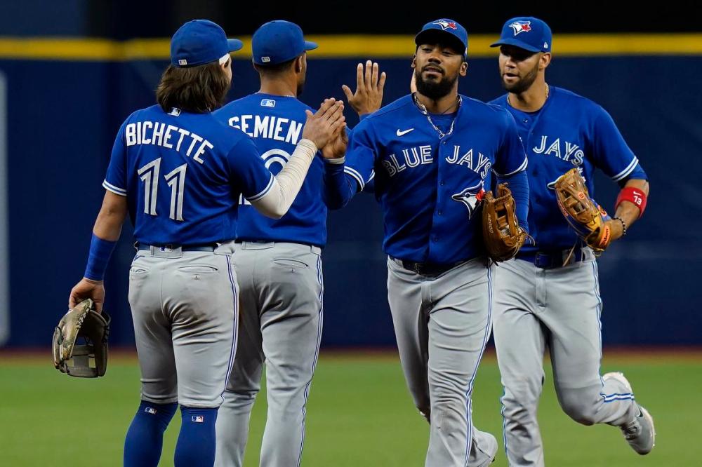 Chris O'Meara - The Associated Press
Bo Bichette, Marcus Semien, Teoscar Hernández and Lourdes Gurriel Jr. start the celebration after the Blue Jays’ 4-2 win over the Rays at Tropicana Field on Tuesday night.